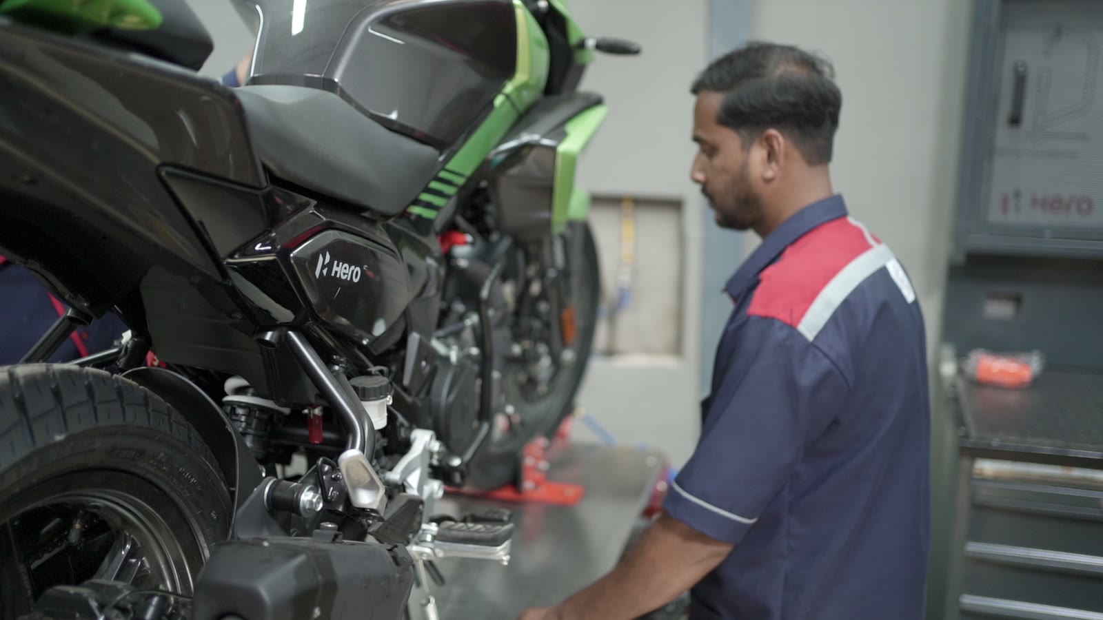 Technician servicing a motorcycle